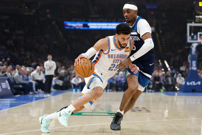Mar 15, 2026; Oklahoma City, Oklahoma, USA; Oklahoma City Thunder guard Ajay Mitchell (25) drives to the basket against Minnesota Timberwolves guard Bones Hyland (8) during the first half at Paycom Center. Mandatory Credit: Alonzo Adams-Imagn Images