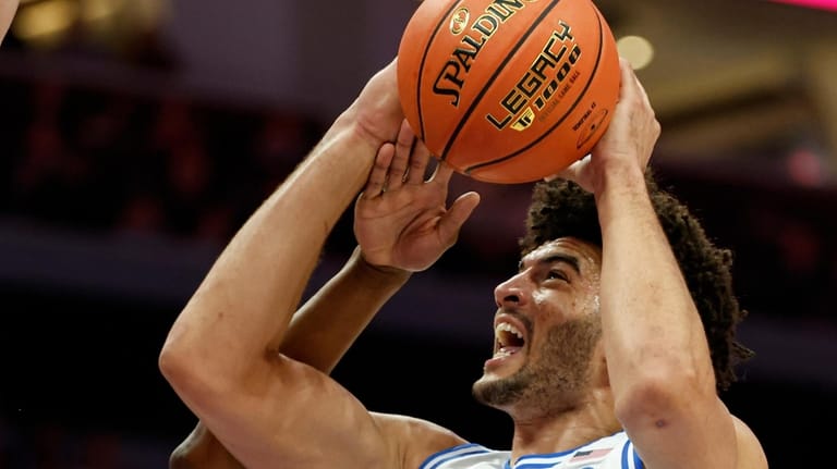 Duke forward Cameron Boozer drives to the basket against Clemson...