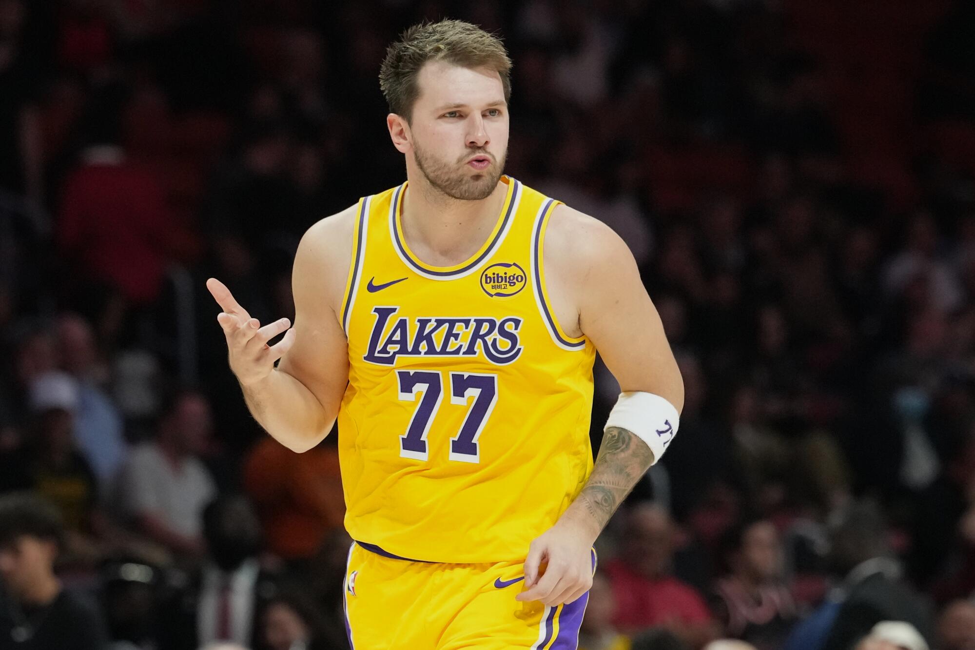 Lakers star Luka Doncic celebrates after scoring in the second half against the Heat on Thursday.