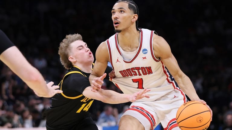 Houston guard Milos Uzan (7) drives against Idaho guard Kolton...
