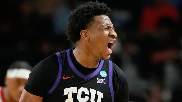 TCU forward Xavier Edmonds (24) celebrates scoring during the first...