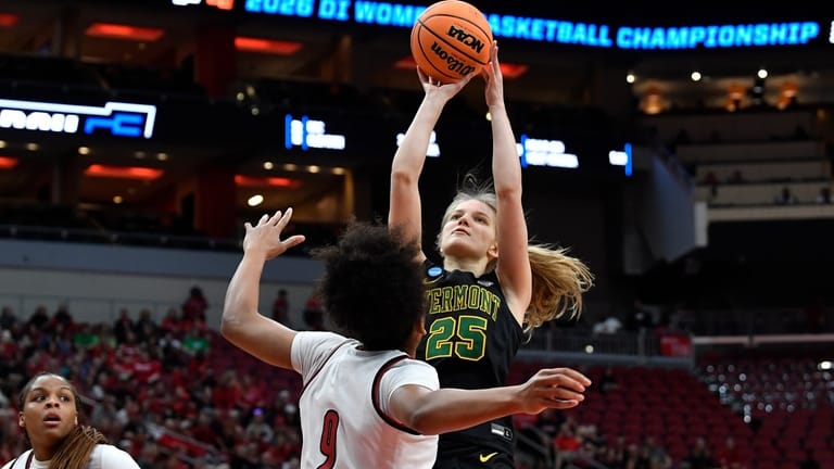 Vermont center Nikola Priede (25) shoots over Louisville guard Reyna...