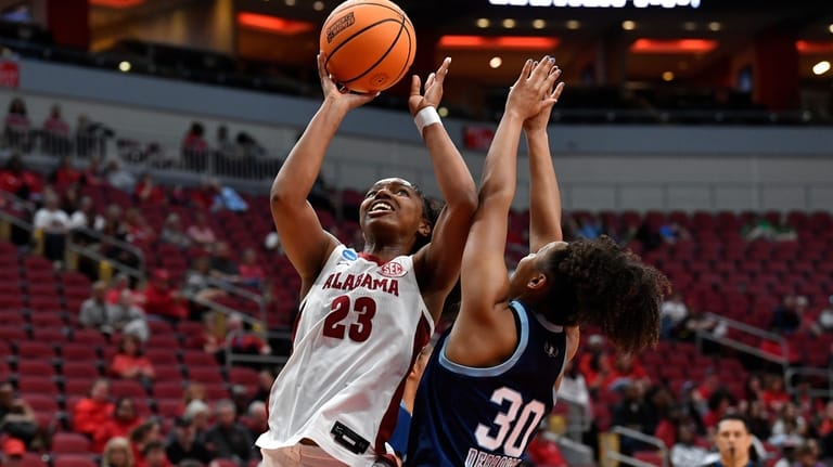 Alabama guard Jessica Timmons (23) shoots over Rhode Island guard...