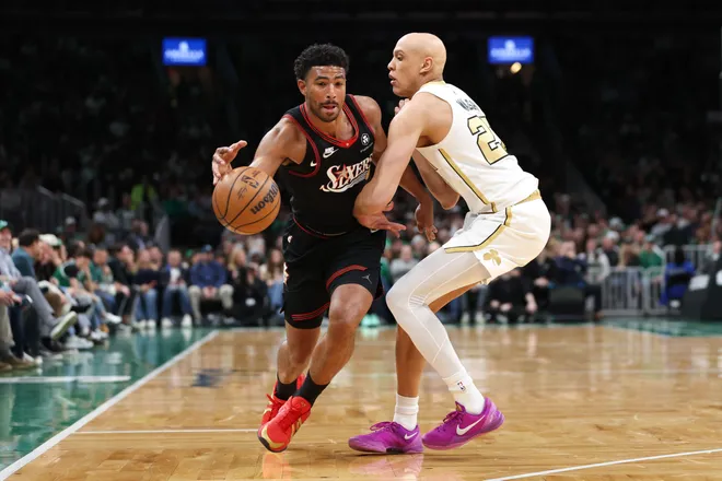 Mar 1, 2026; Boston, Massachusetts, USA; Philadelphia 76ers guard Quentin Grimes (5) drives to the basket defended by Boston Celtics forward Jordan Walsh (27) during the first half at TD Garden. Mandatory Credit: Paul Rutherford-Imagn Images