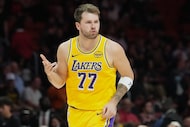 Los Angeles Lakers guard Luka Doncic (77) reacts after scoring during the second half of an...