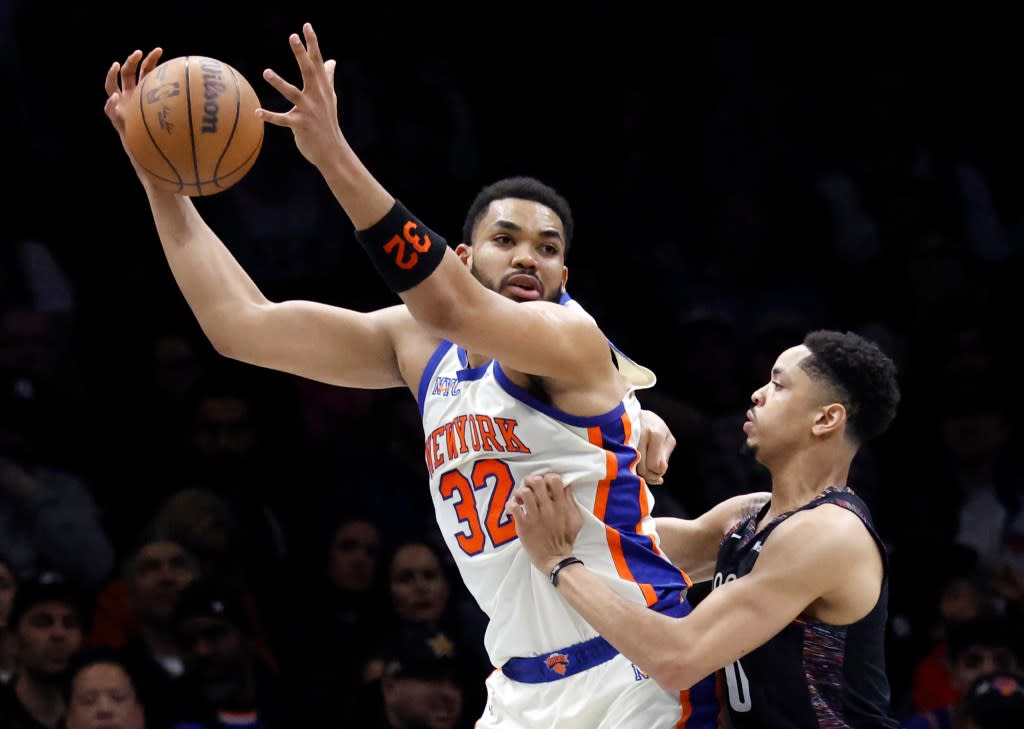 Karl-Anthony Towns, who scored 26 points and grabbed 15 rebounds, looks to make a move on Josh Minott during the Knicks’ 93-92 win over the Nets on March 20, 2026 at Barclays Center. Jason Szenes for New York Post