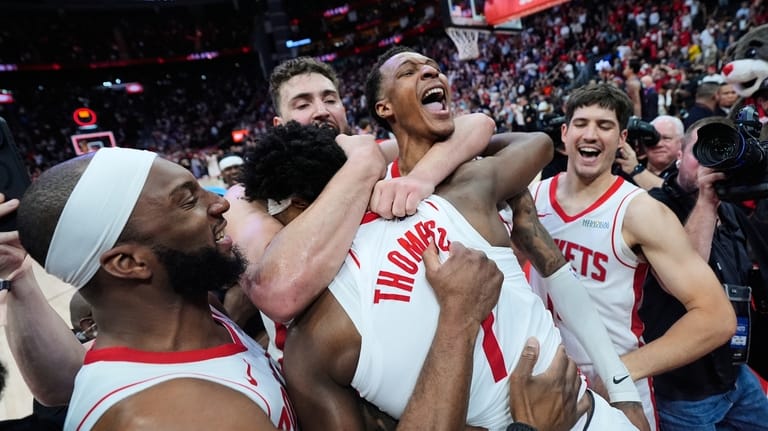 Houston Rockets guard Amen Thompson (1) celebrates with teammates after...