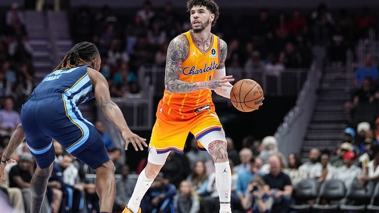 Charlotte Hornets guard LaMelo Ball (1) brings the ball up...