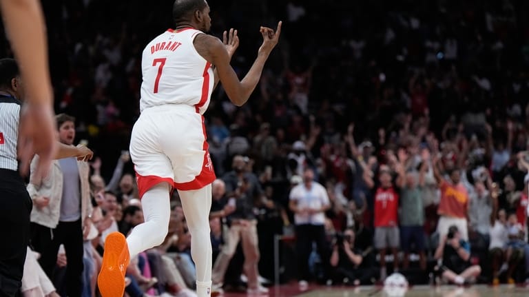 Houston Rockets forward Kevin Durant (7) celebrates after a 3-pointer...