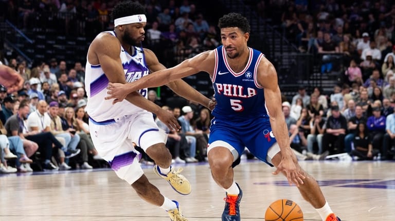 Philadelphia 76ers guard Quentin Grimes (5) dribbles around Utah Jazz...