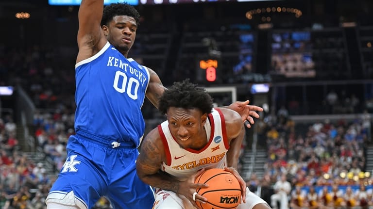 Iowa State's Jamarion Batemon looks for a way around Kentucky's...