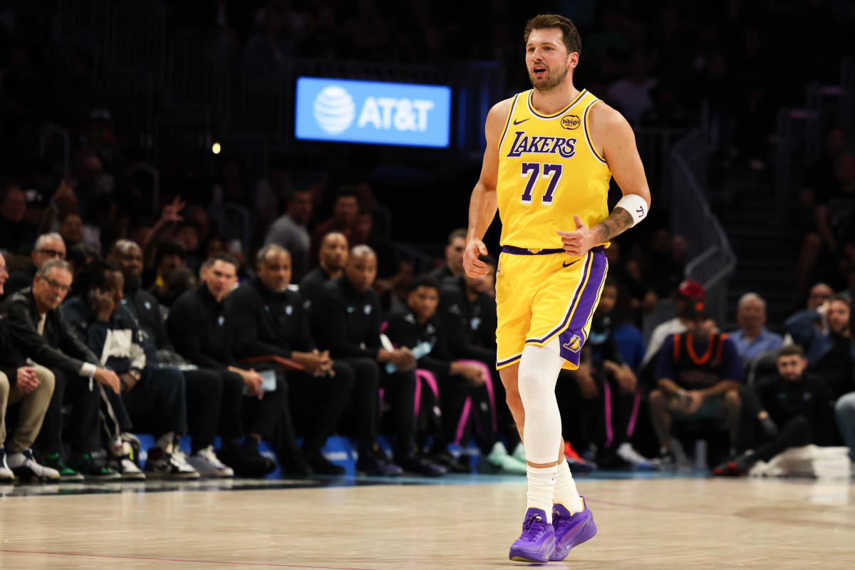 Los Angeles Lakers guard Luka Doncic (77) reacts after point against Miami Heat.Isabella Frias-Imagn Images