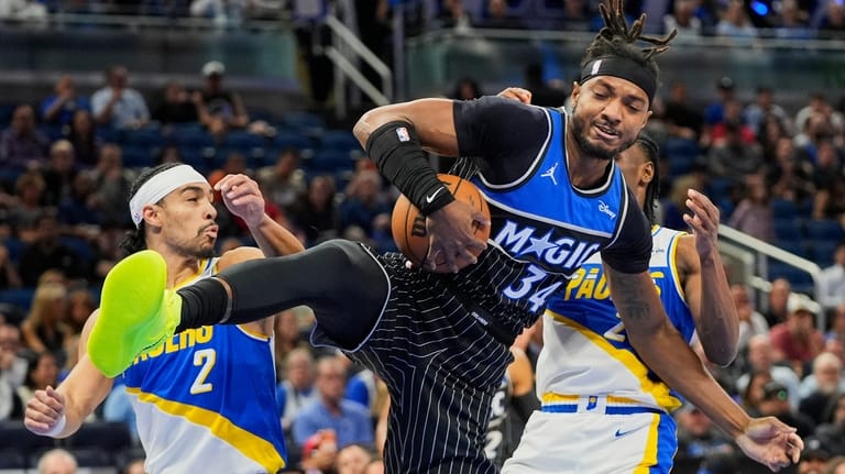 Orlando Magic center Wendell Carter Jr. (34) grabs a rebound...