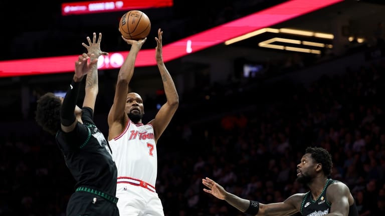 Houston Rockets forward Kevin Durant (7) shoots against Minnesota Timberwolves...