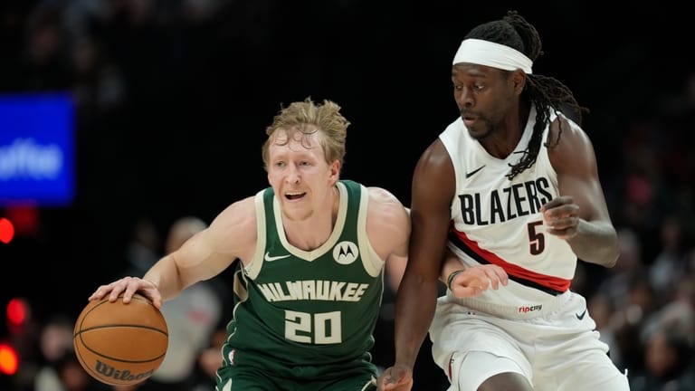 Milwaukee Bucks guard AJ Green (20) tries to get past...