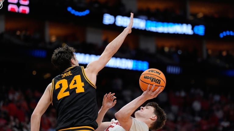 Nebraska forward Braden Frager (5) shoots as Iowa guard Tate...