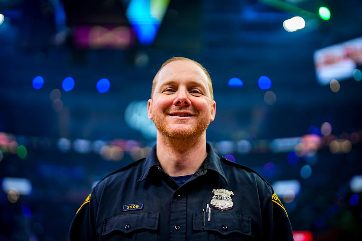 Chris Porter, a 42-year-old Cleveland police officer, works his post during a Cavaliers game against the Miami Heat at Rocket Arena.