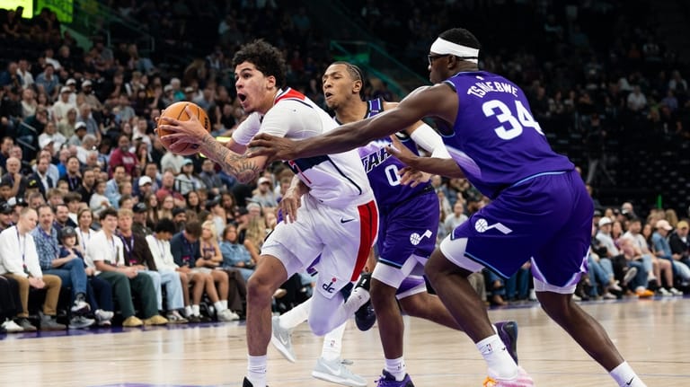 Utah Jazz forward Oscar Tshiebwe (34) and Utah Jazz forward...