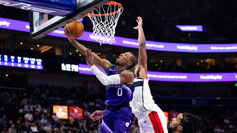 Utah Jazz forward Kennedy Chandler (0) shoots a layup during...