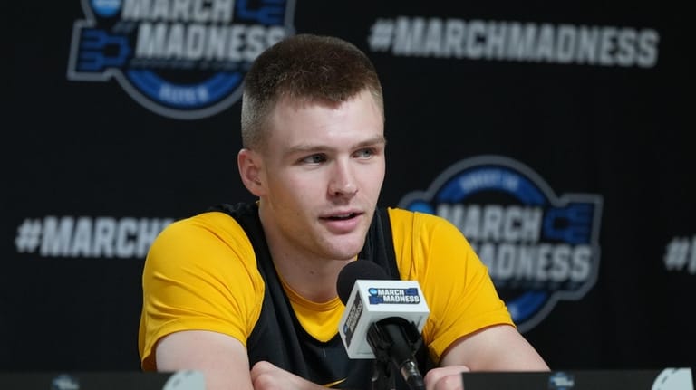 Iowa guard Bennett Stirtz answers questions during a news conference...