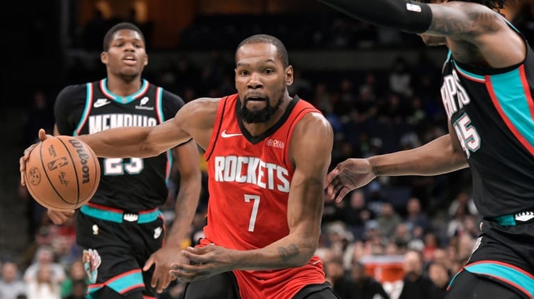 Houston Rockets forward Kevin Durant (7) handles the ball against...