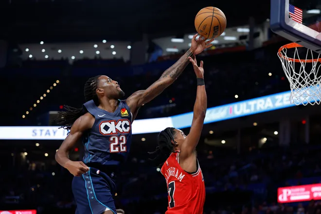 Mar 27, 2026; Oklahoma City, Oklahoma, USA; Oklahoma City Thunder guard Cason Wallace (22) blocks a shot by Chicago Bulls guard Rob Dillingham (7) during the second half at Paycom Center. Mandatory Credit: Alonzo Adams-Imagn Images