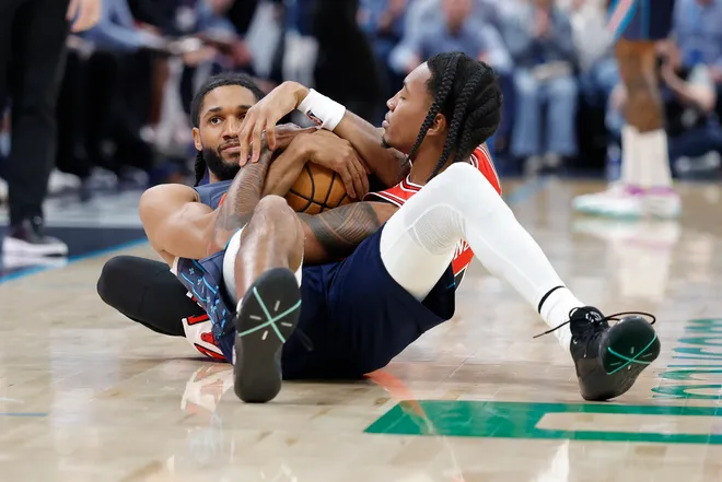 Mar 27, 2026; Oklahoma City, Oklahoma, USA; Oklahoma City Thunder guard Isaiah Joe (11) and Chicago Bulls guard Rob Dillingham (7) fight for a loose ball during the second half at Paycom Center. Mandatory Credit: Alonzo Adams-Imagn Images