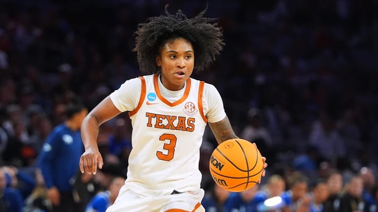 Texas guard Rori Harmon handles the ball in the second...