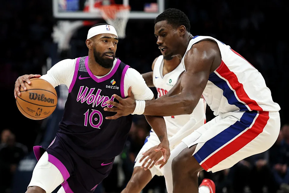 Minnesota Timberwolves guard Mike Conley (10) works around Detroit Pistons center Jalen Duren (0) during the first half at Target Center in Minneapolis on Saturday, March 28, 2026.