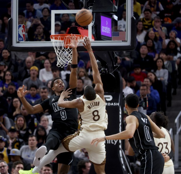 Golden State Warriors' De'anthony Melton #8 shoots a basket past Brooklyn Nets' E.J. Liddell #9 in the fourth quarter of their NBA game at the Chase Center in San Francisco, Calif., on Wednesday, March 25, 2026. (Jane Tyska/Bay Area News Group)