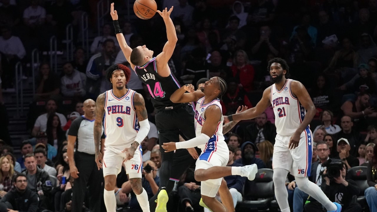 Heat rally late, use 14-0 run in final moments to pull away and beat 76ers 119-109