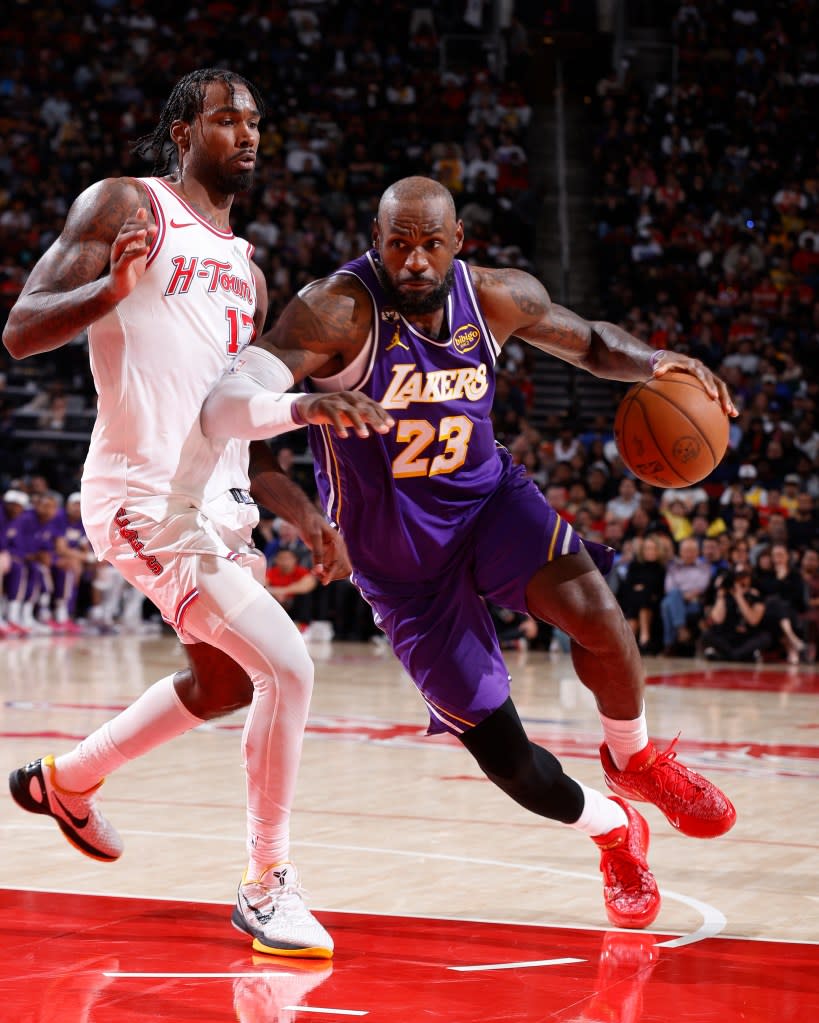LeBron James of the Los Angeles Lakers drives to the basket during the game against the Houston Rockets on March 18, 2026 at the Toyota Center in Houston, Texas. (Photo by Logan Riely/NBAE via Getty Images) NBAE via Getty Images