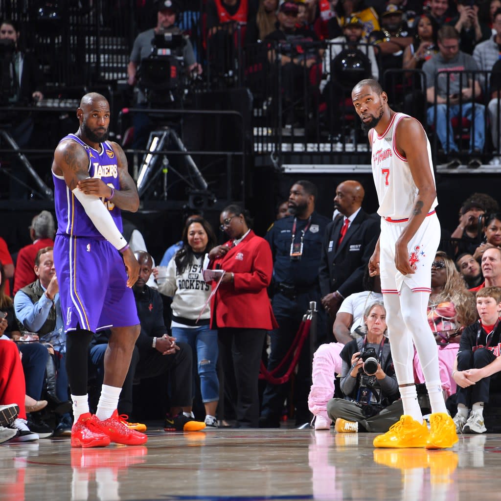 LeBron James of the Los Angeles Lakers and Kevin Durant of the Houston Rockets look on during the game on March 18, 2026 at the Toyota Center in Houston, Texas. (Photo by Michael Gonzales/NBAE via Getty Images) NBAE via Getty Images