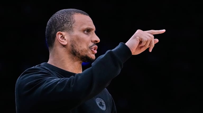 Boston Celtics head coach Joe Mazzulla calls to his players...