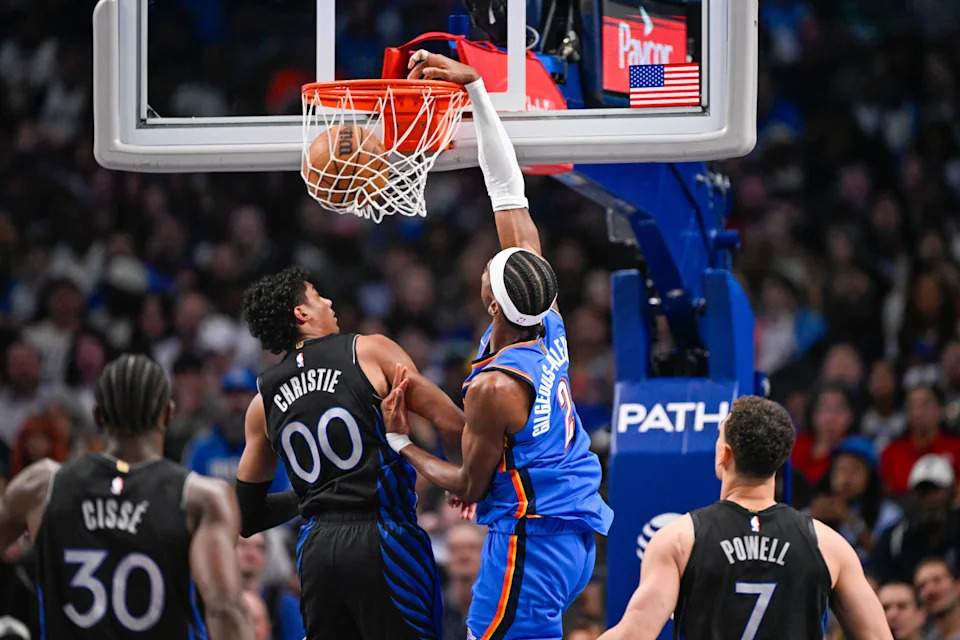 Mar 1, 2026; Dallas, Texas, USA; Oklahoma City Thunder guard Shai Gilgeous-Alexander (2) dunks the ball over Dallas Mavericks guard Max Christie (00) during the second quarter at the American Airlines Center. Mandatory Credit: Jerome Miron-Imagn Images