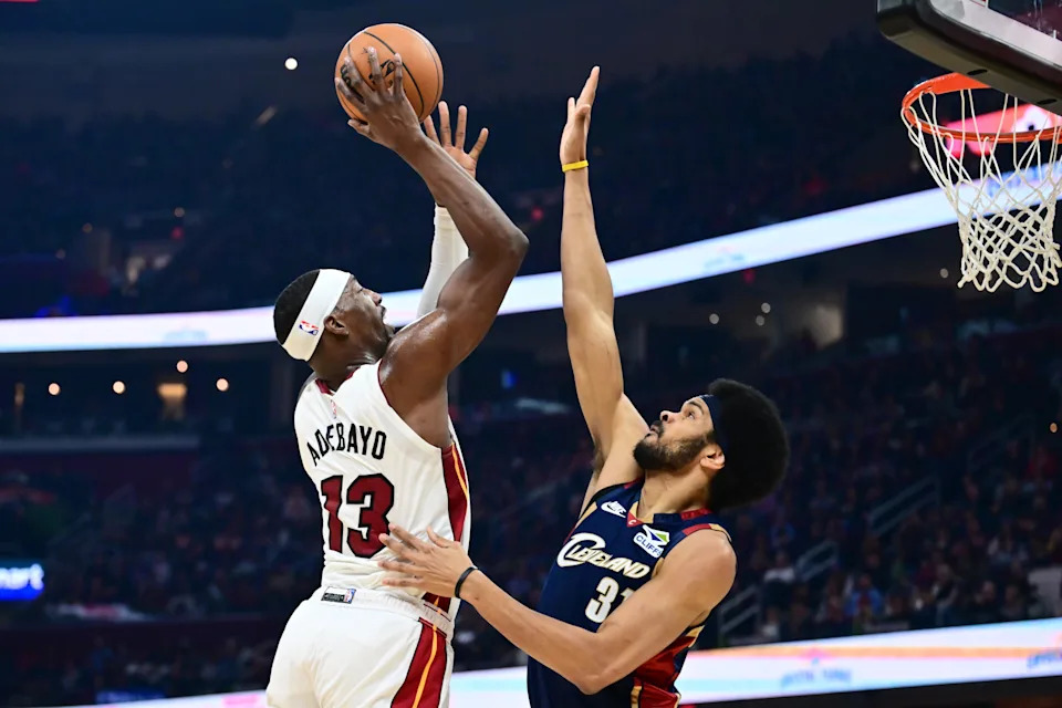Mar 27, 2026; Cleveland, Ohio, USA; Miami Heat center Bam Adebayo (13) shoots over the defense of Cleveland Cavaliers center Jarrett Allen (31) during the first half at Rocket Arena. Mandatory Credit: Ken Blaze-Imagn Images