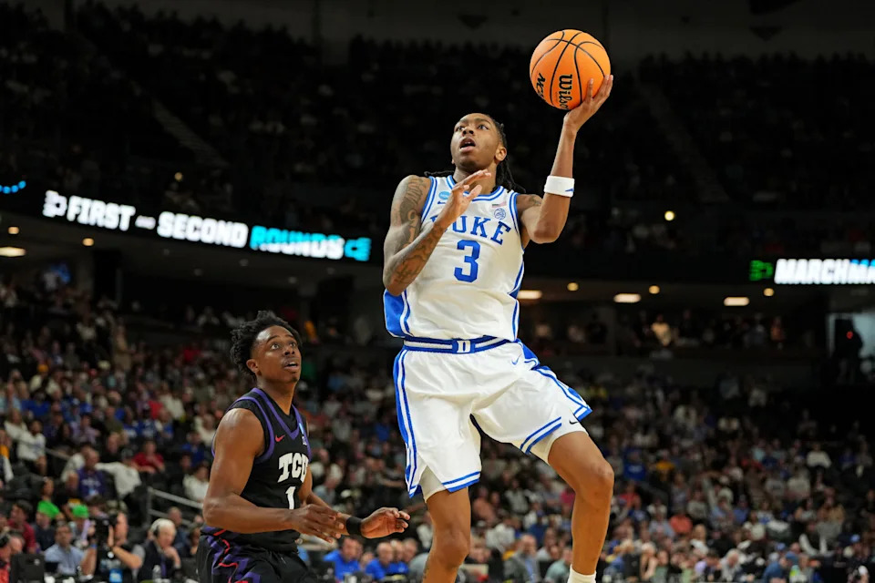 Mar 21, 2026; Greenville, SC, USA; Duke Blue Devils guard Isaiah Evans (3) drives to the basket against Texas Christian University Horned Frogs guard Jayden Pierre (1) during the first half during a second round game of the men's 2026 NCAA Tournament at Bon Secours Wellness Arena. Mandatory Credit: Bob Donnan-Imagn Images