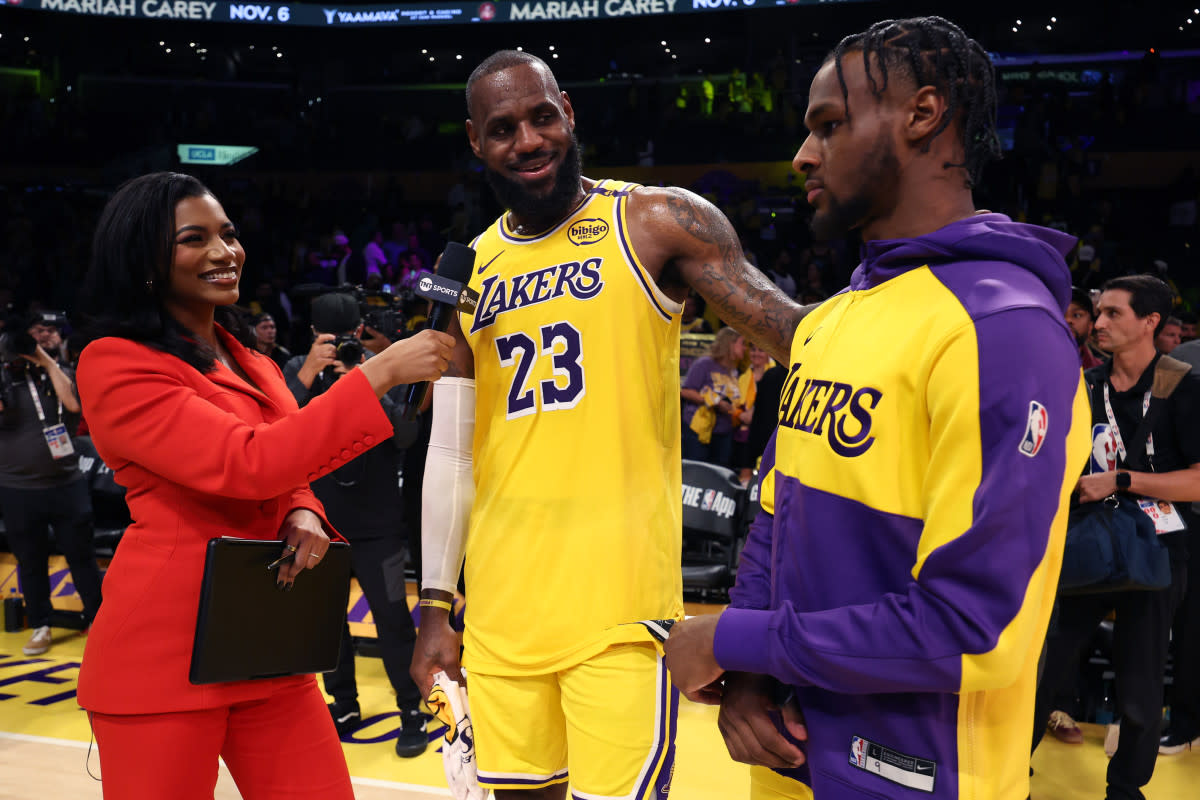 LeBron James and Bronny James of the Los Angeles Lakers are interviewed on the court.Harry How / Getty Images
