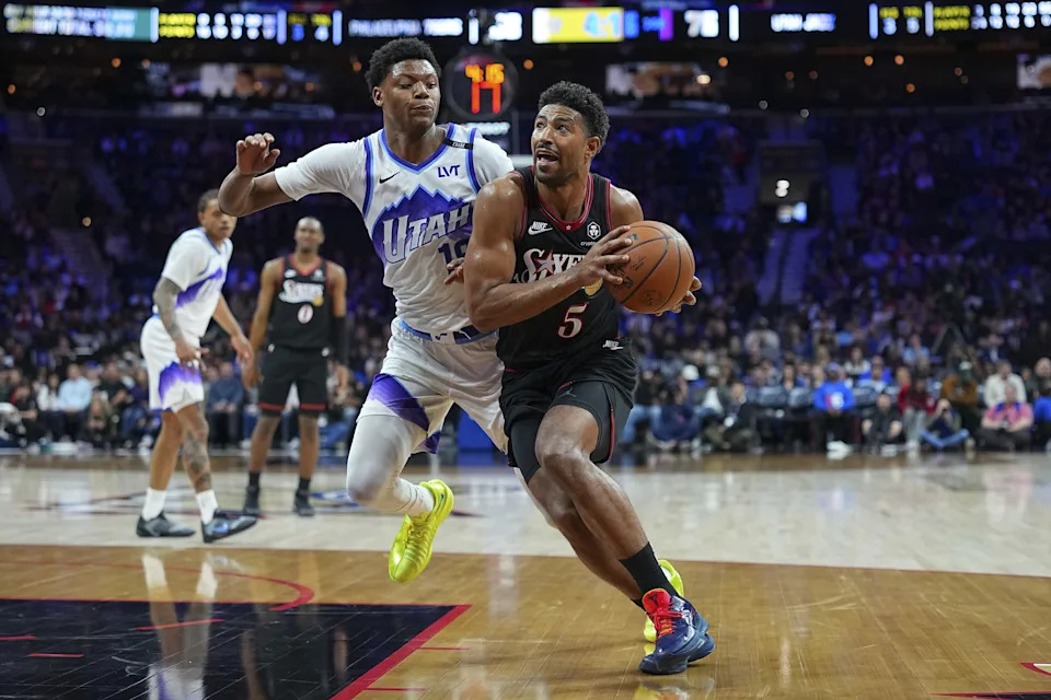 PHILADELPHIA, PENNSYLVANIA – MARCH 4: Quentin Grimes #5 of the Philadelphia 76ers drives to the basket against Ace Bailey #19 of the Utah Jazz in the third quarter at Xfinity Mobile Arena on March 4, 2026 in Philadelphia, Pennsylvania. The 76ers defeated the Jazz 106-102. NOTE TO USER: User expressly acknowledges and agrees that, by downloading and or using this photograph, User is consenting to the terms and conditions of the Getty Images License Agreement. (Photo by Mitchell Leff/Getty Images) | Getty Images