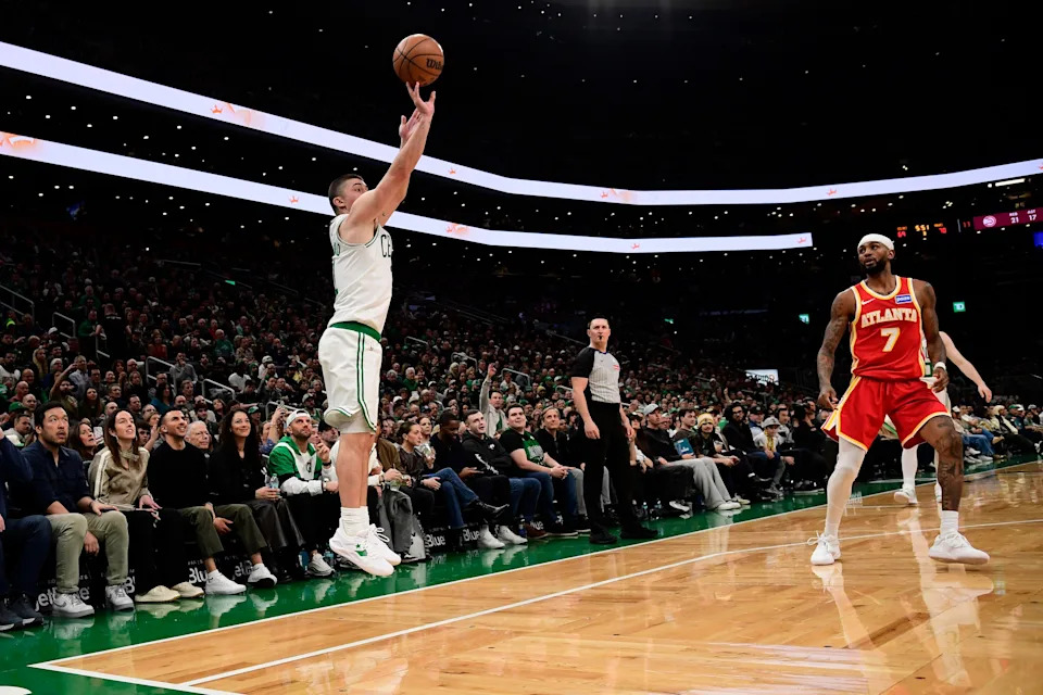 Mar 27, 2026; Boston, Massachusetts, USA; Boston Celtics guard Payton Pritchard (11) shoots against Atlanta Hawks guard Nickeil Alexander-Walker (7) during the second half at TD Garden. Mandatory Credit: Bob DeChiara-Imagn Images