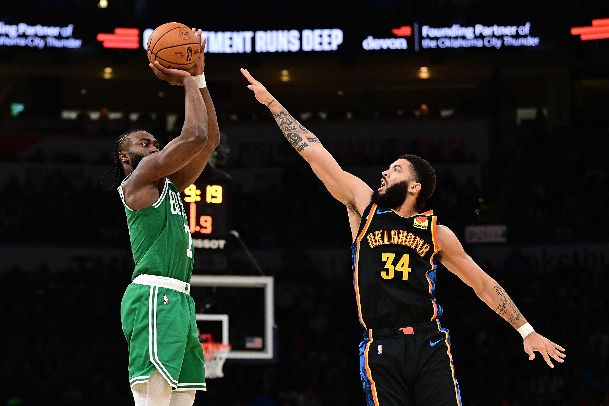 Boston Celtics star Jaylen Brown is defended by Kenrich Williams of the Oklahoma City Thunder.
