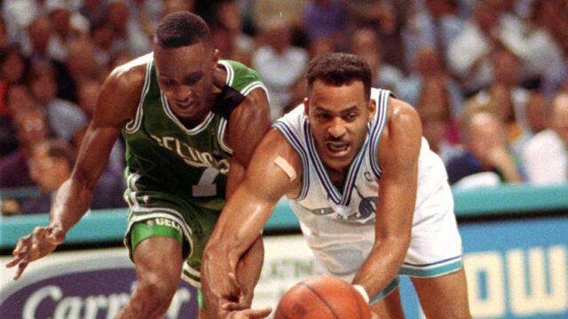 Dell Curry fights Dee Brown for the ball in a 1993 game.