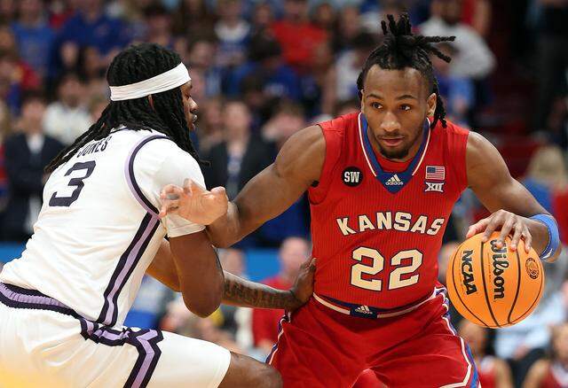 LAWRENCE, KANSAS - MARCH 07: Darryn Peterson #22 of the Kansas Jayhawks controls the ball as CJ Jones #3 of the Kansas State Wildcats during the game at Allen Fieldhouse on March 07, 2026 in Lawrence, Kansas. (Photo by Jamie Squire/Getty Images)