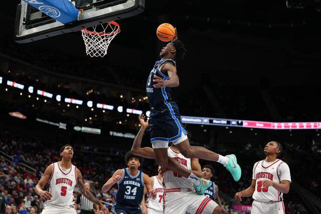 KANSAS CITY, MISSOURI - MARCH 12: AJ Dybantsa #3 of the BYU Cougars goes up for a dunks against the Houston Cougars in the first half during the quarterfinals of the Big 12 Tournament at T-Mobile Center on March 12, 2026 in Kansas City, Missouri. (Photo by Ed Zurga/Getty Images)