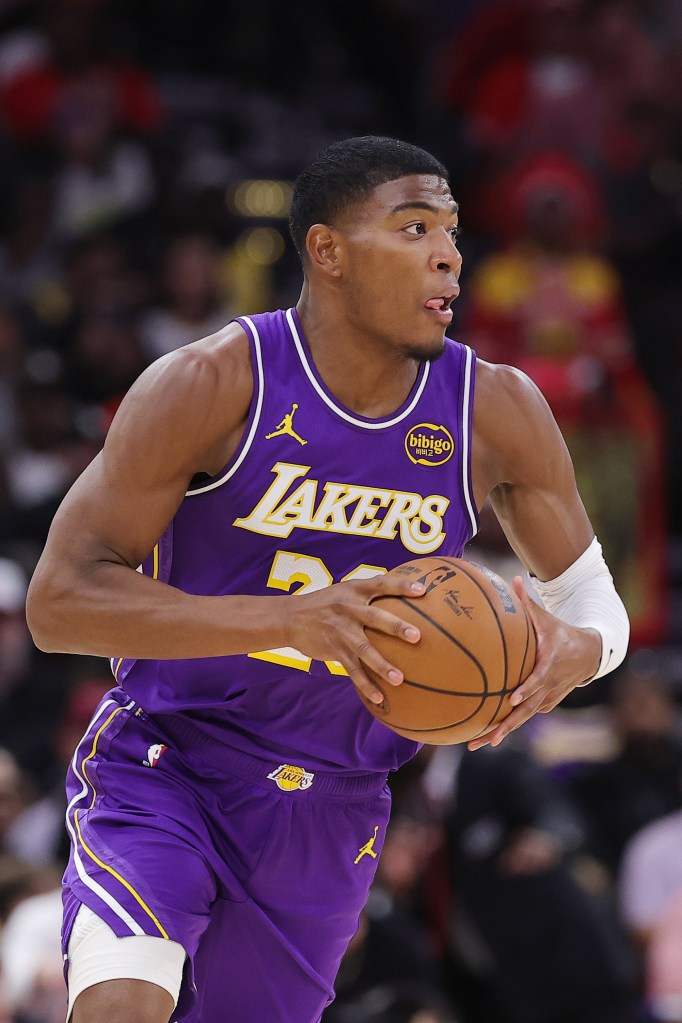 Rui Hachimura dribbles the ball up the court.