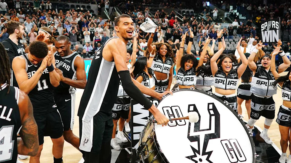 Mar 5, 2026; San Antonio, Texas, USA; San Antonio Spurs forward forward Victor Wembanyama (1) beats a drum and leads fans on a cheer after a victory over the Detroit Pistons at Frost Bank Center. Mandatory Credit: Scott Wachter-Imagn Images
