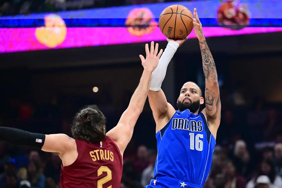 Dallas Mavericks forward Caleb Martin (16) shoots over Cleveland Cavaliers guard Max Strus (2) on March 15, 2026, in Cleveland.