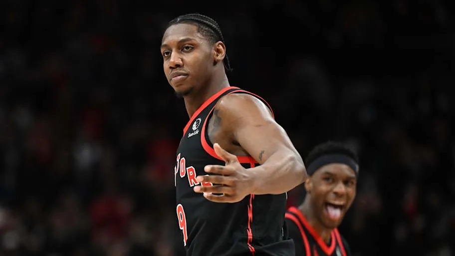 Toronto Raptors forward RJ Barrett celebrates with guard Ja'Kobe Walter