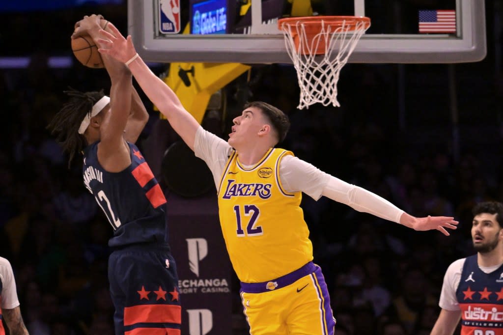 Jake LaRavia fights for to a rebound during the first half. Jayne Kamin-Oncea-Imagn Images