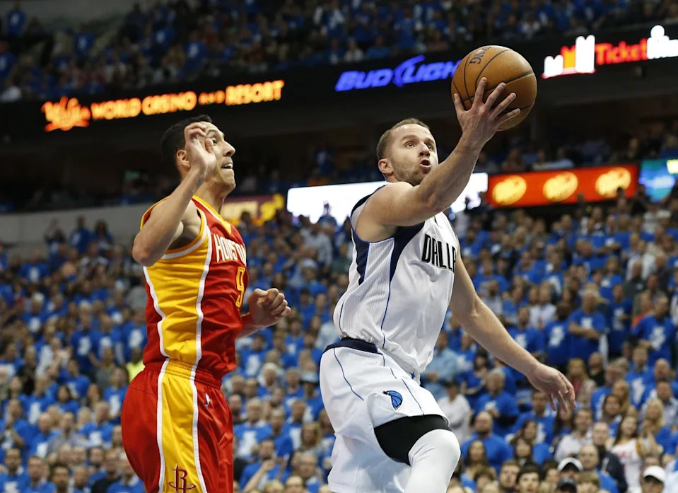 Apr 24, 2015; Dallas, TX, USA; Dallas Mavericks guard Jose Juan Barea (5) shoots against Houston Rockets guard Pablo Prigioni (9) in game three of the first round of the NBA Playoffs at American Airlines Center. Mandatory Credit: Matthew Emmons-USA TODAY Sports